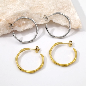 Minimalist irregular wave-shaped hollow hoop earrings in gold and silver finish