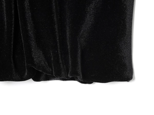 Detailed macro view of premium black velvet fabric texture and stitching on the top