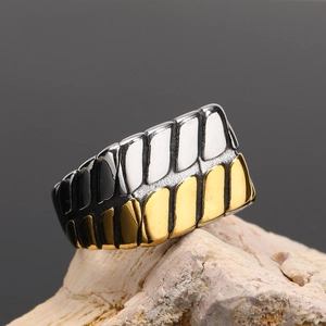 Detail of multi-color titanium steel chain ring with gold and silver gear patterns
