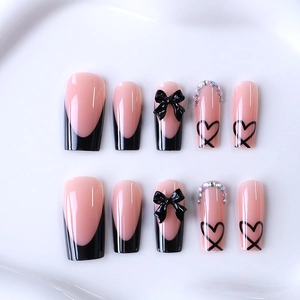 Long coffin press-on nails with black French tips, 3D bows and rhinestone accents