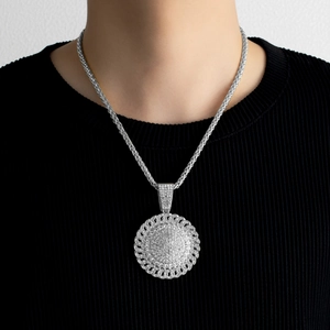 Men's hip-hop iced-out round pendant necklace with silver woven chain on model