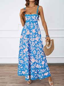 Detail of blue floral sundress featuring wavy trim on straps and bust for summer style