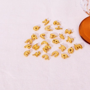 Polished golden 3D bubble letter charms A-Z set in minimalist stainless steel
