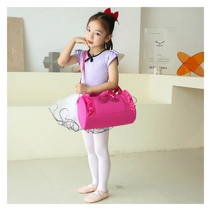 Detail of rose pink ballet bag featuring ruffled edges and glitter dance shoes pattern