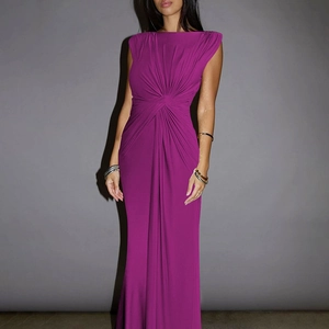 Detail of waist knot draping and pleated texture on magenta sleeveless maxi dress
