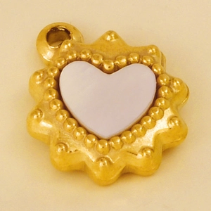 Macro detail of golden 304 stainless steel heart pendant with white shell inlay