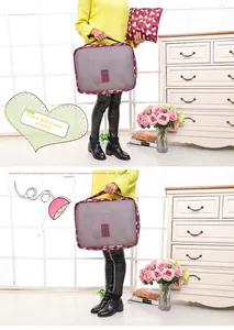 Detail view of floral travel organizer showing mesh panel, handle and zipper closure