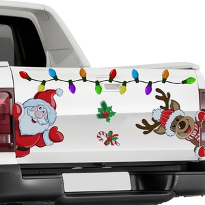 Detail of magnetic Christmas car stickers with Santa and reindeer on white pickup truck