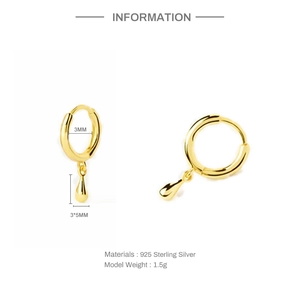 Detail of gold 925 sterling silver hoop earrings featuring a small water drop pendant