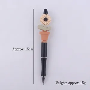 Creative sunflower potted plant gel pen with black barrel and silicone flower topper