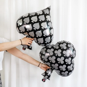 Detail showing high-quality black aluminum foil balloons with spade and club poker symbols