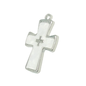 Detailed view of silver cross pendant with white inlay and centered small cross emblem