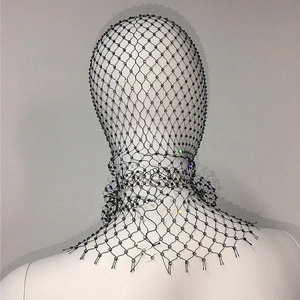 Detailed view of black elastic fishnet headgear with shimmering rhinestones on a white mannequin