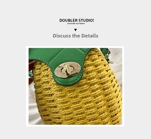 Detailed close-up of pineapple-shaped woven straw bag with green leaf flap and gold lock