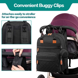 Detail of waterproof quilted diaper bag hanging on a stroller with convenient buggy clips