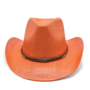 Detail of orange straw cowboy hat featuring woven texture and studded leather band