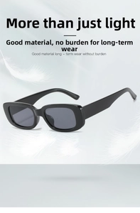 Lightweight black vintage rectangle sunglasses shown with feathers to highlight weightless feel
