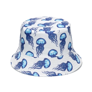 White bucket hat featuring blue jellyfish all-over print with a flat top and stitched brim