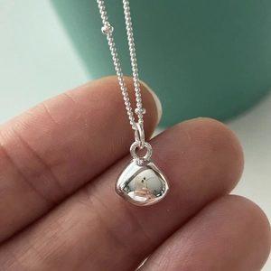 Elegant 925 sterling silver fine chain necklace with a polished bean drop pendant for women