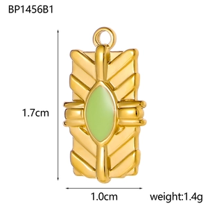 Detailed view of golden rectangle pendant with green inlay and sunburst texture