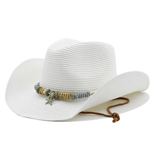 Detail of white straw cowboy hat with colorful braided band and starfish charm decoration