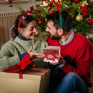 Christmas cash pull box with Santa and reindeer motifs for festive party gift giving