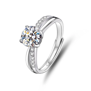 Macro shot of silver S925 sterling silver four-prong hollow cross ring with moissanite