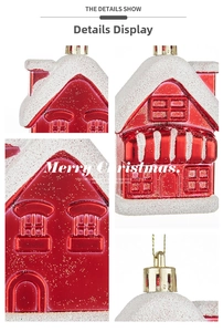 Close-up of red Christmas house ornament with white snow coating and gold glitter accents