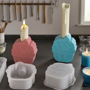 Detail of cupcake silicone mold set with pink and blue finished aromatherapy candles