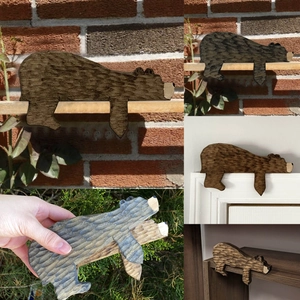 Handcrafted brown wooden bear door frame topper ornament for shelf and home decor