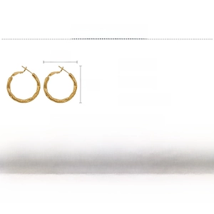 Macro detail of textured gold hoop earrings with wave pattern dimensions and silver post