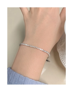 Close-up of S925 sterling silver tennis bracelet featuring sparkling round-cut cubic zirconia