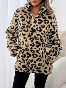 Detail of soft leopard print fleece hoodie with high-collar zipper and kangaroo pocket