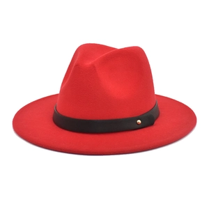 Close-up of red wide-brim wool fedora hat with black leather belt and gold studs decoration