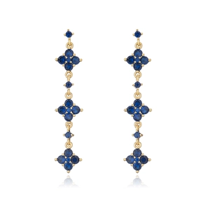 Detail of 18K gold-plated earrings with deep blue zircons and geometric floral tassels
