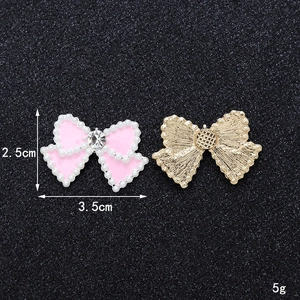 Pink pearl bowknot charm for DIY accessories, 3.5cm wide with golden metal back view