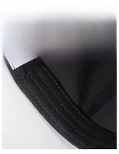 Detail view of the wide sweatband and breathable mesh fabric of this quick-dry skull cap