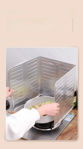 Foldable aluminum foil splatter guard shown protecting dual burners on a kitchen stove