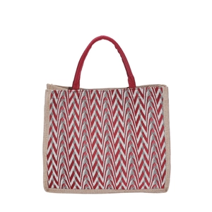 Large striped jute tote bag with red chevron woven pattern and sturdy fabric handles