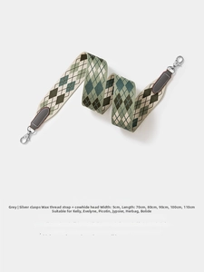 Detailed view of gray argyle woven wide shoulder strap with silver lobster clasps