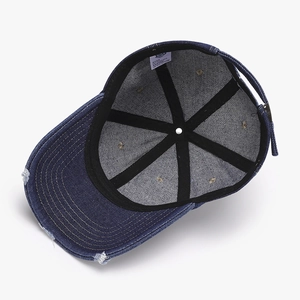 Deep blue washed denim baseball hat featuring distressed details and vintage inner structure