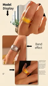 Detailed view of wide titanium steel rings with gold and silver finishes and zircon edges