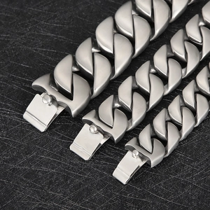Detail of heavy duty polished stainless steel Cuban chains with square buckle clasps