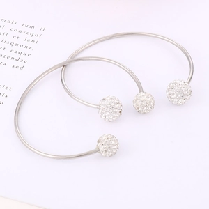 Sleek C-shaped titanium steel cuff bracelet featuring sparkling pave-set crystal balls