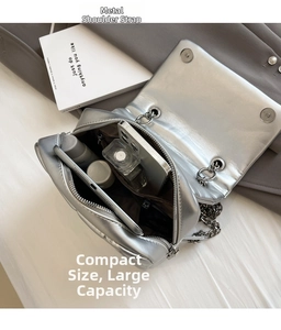 Silver chain bag interior view showing storage for phone, perfume and makeup
