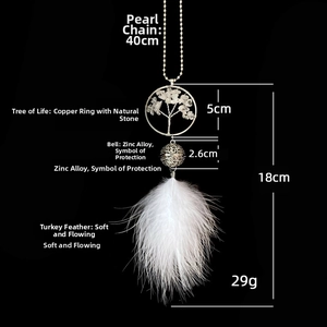 Macro shot of tree of life charm with natural stones and white feathers car accessory