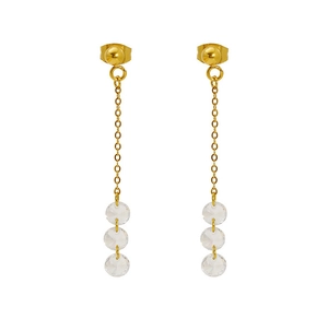 Detail of long tassel earrings with golden chains and transparent zircon beads
