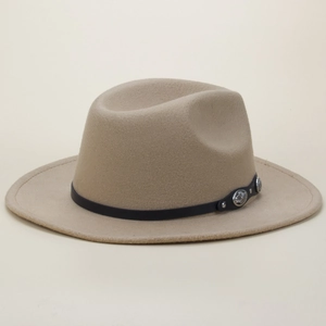 Close-up of beige fedora hat with black leather band and vintage silver metal studs
