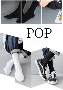 Detail of ribbed knit crew socks in black and white colors for athletic wear