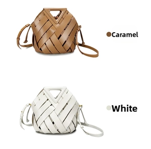 Detail of woven leather handbags in caramel and white with triangular cutout handles